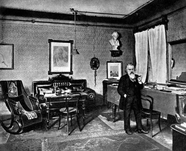 Johannes Brahms (1833-1897) in his lodgings in Vienna. Note: He has a bust of Beethoven on his study shelf.